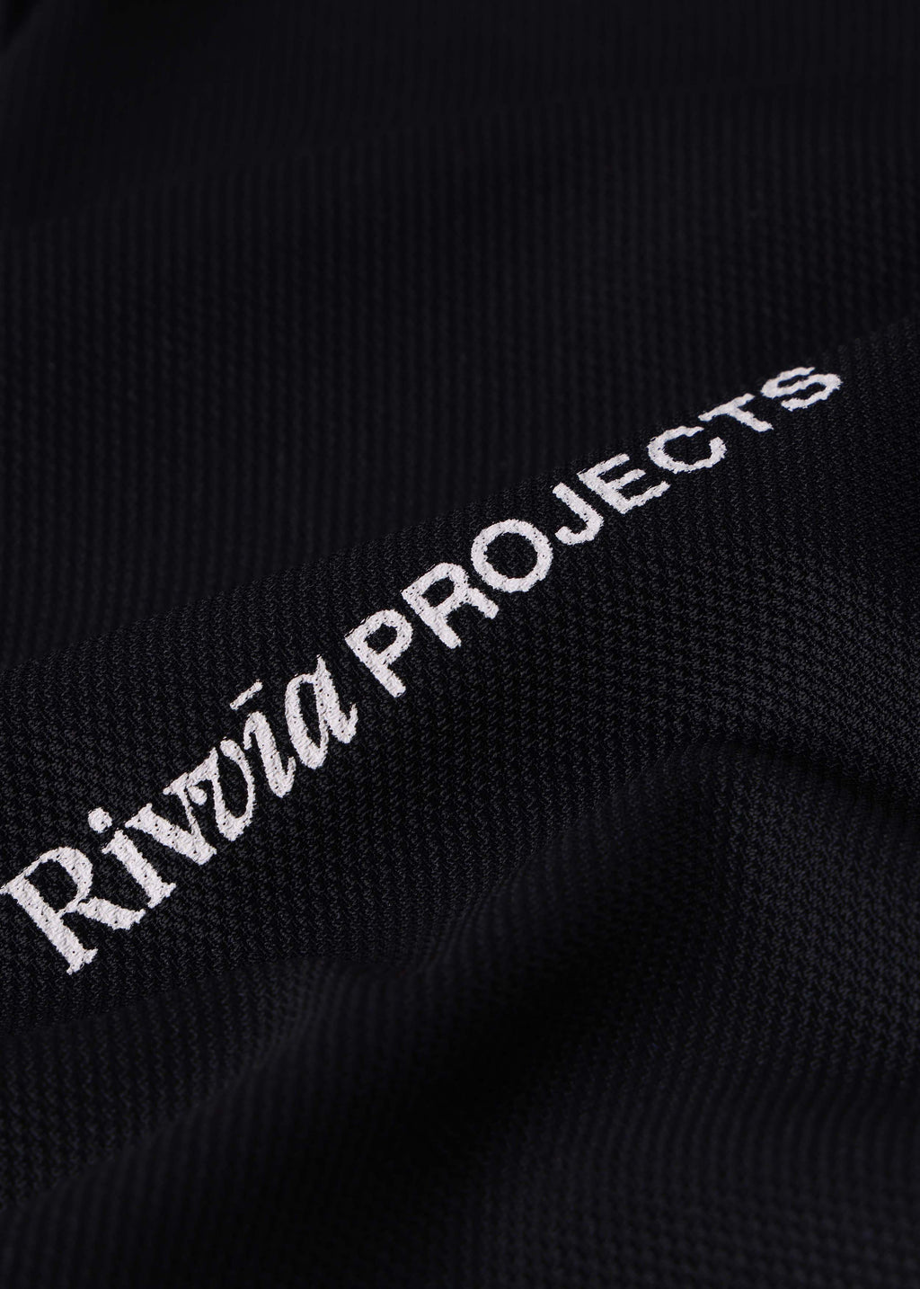 Rivvia Projects Passage Polo in BLACK CHARCOAL