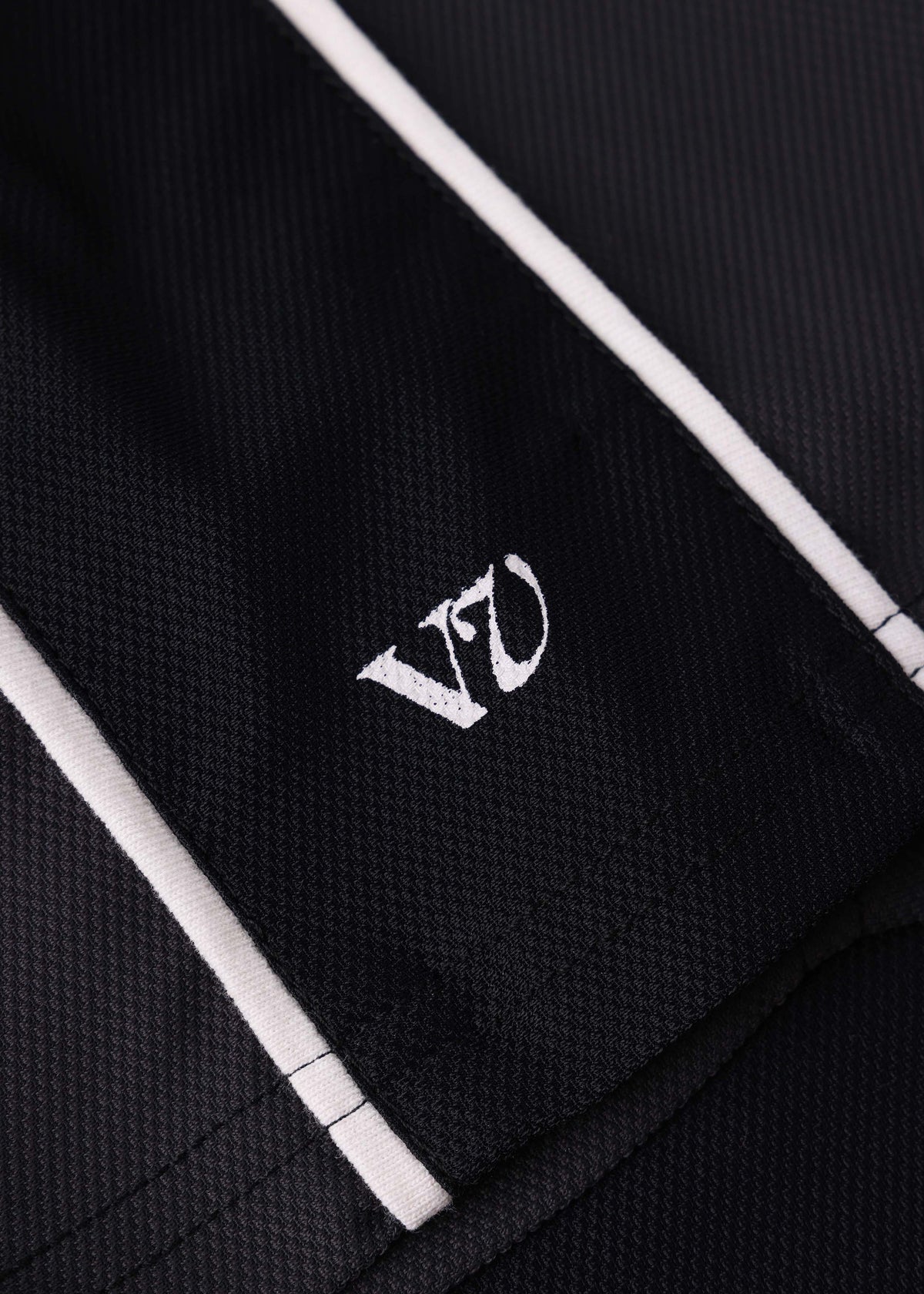 Rivvia Projects Passage Polo in BLACK CHARCOAL