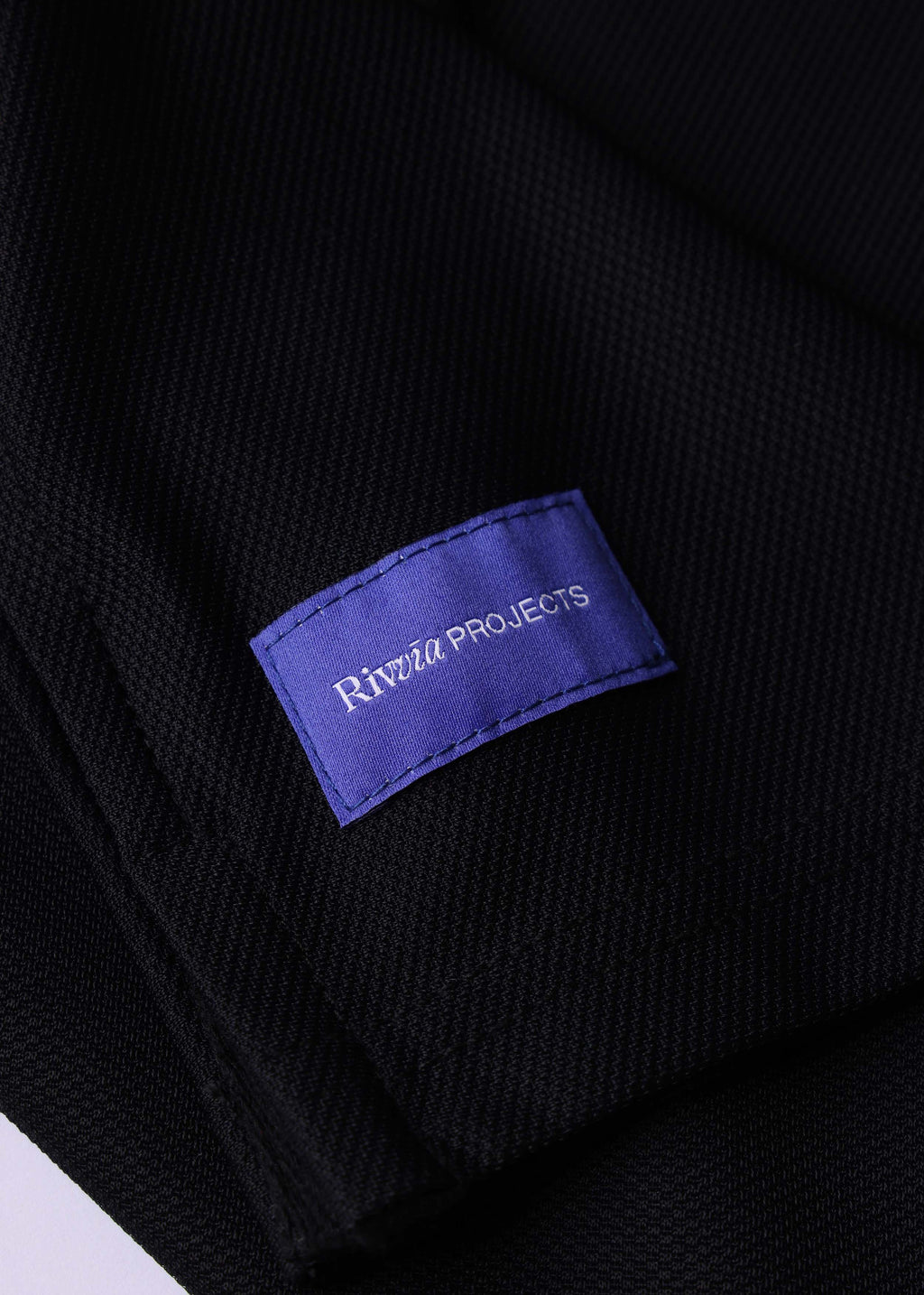 Rivvia Projects Passage Polo in BLACK CHARCOAL